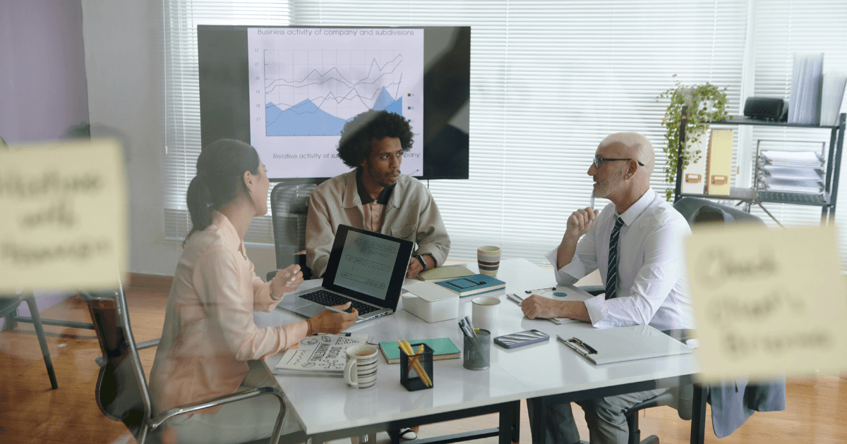 Team collaborating around a strategy table