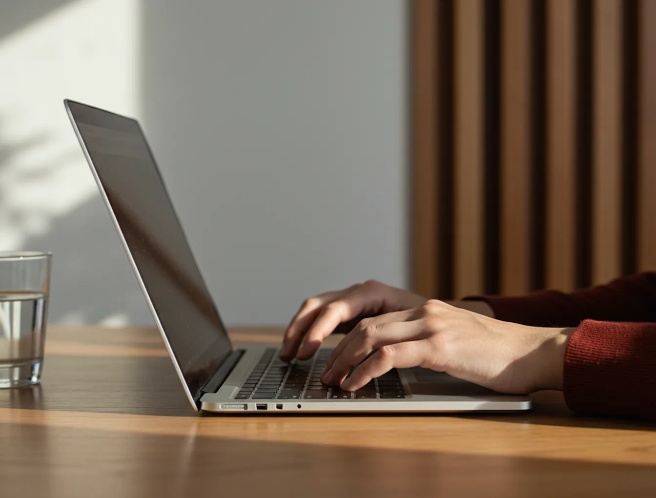 Professional smiling while working at a desk
